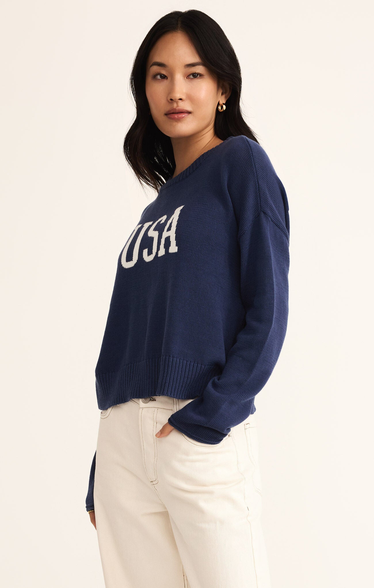 Model wearing ZSupply - Sienna USA Sweater in Yacht Blue.