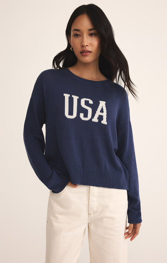 Model wearing ZSupply - Sienna USA Sweater in Yacht Blue.