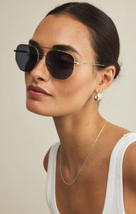 Model wearing ZSupply Highway Sunglasses in Gold - Grey Polarized.