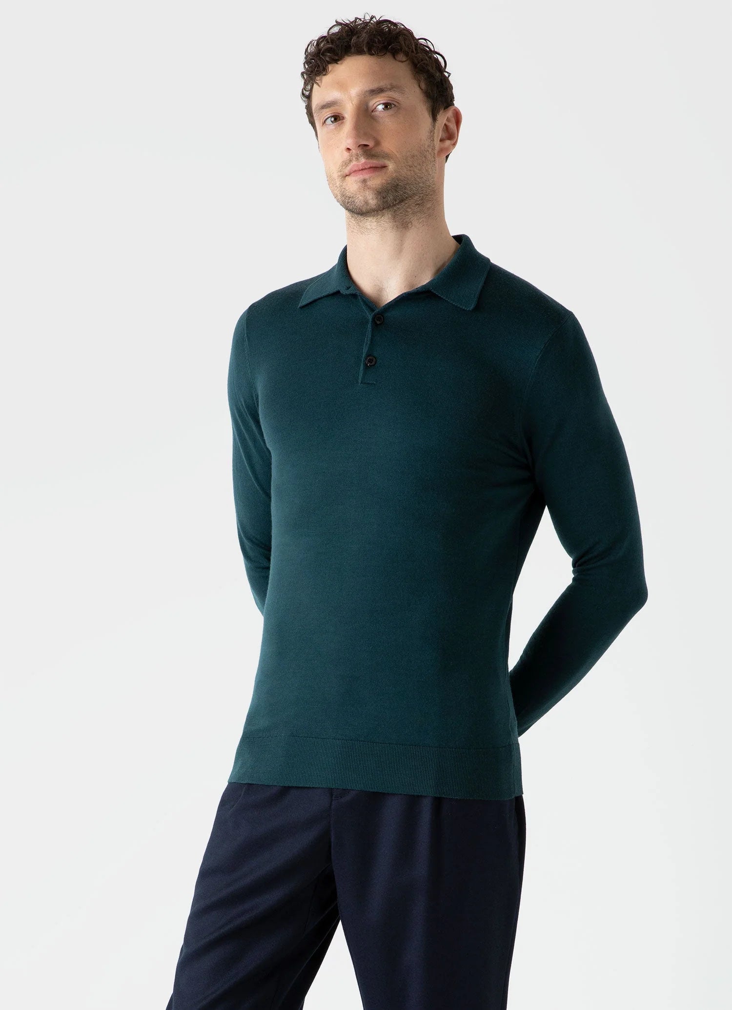 Model wearing Sunspel - Fine Merino Wool LS Polo Shirt in Peacock.