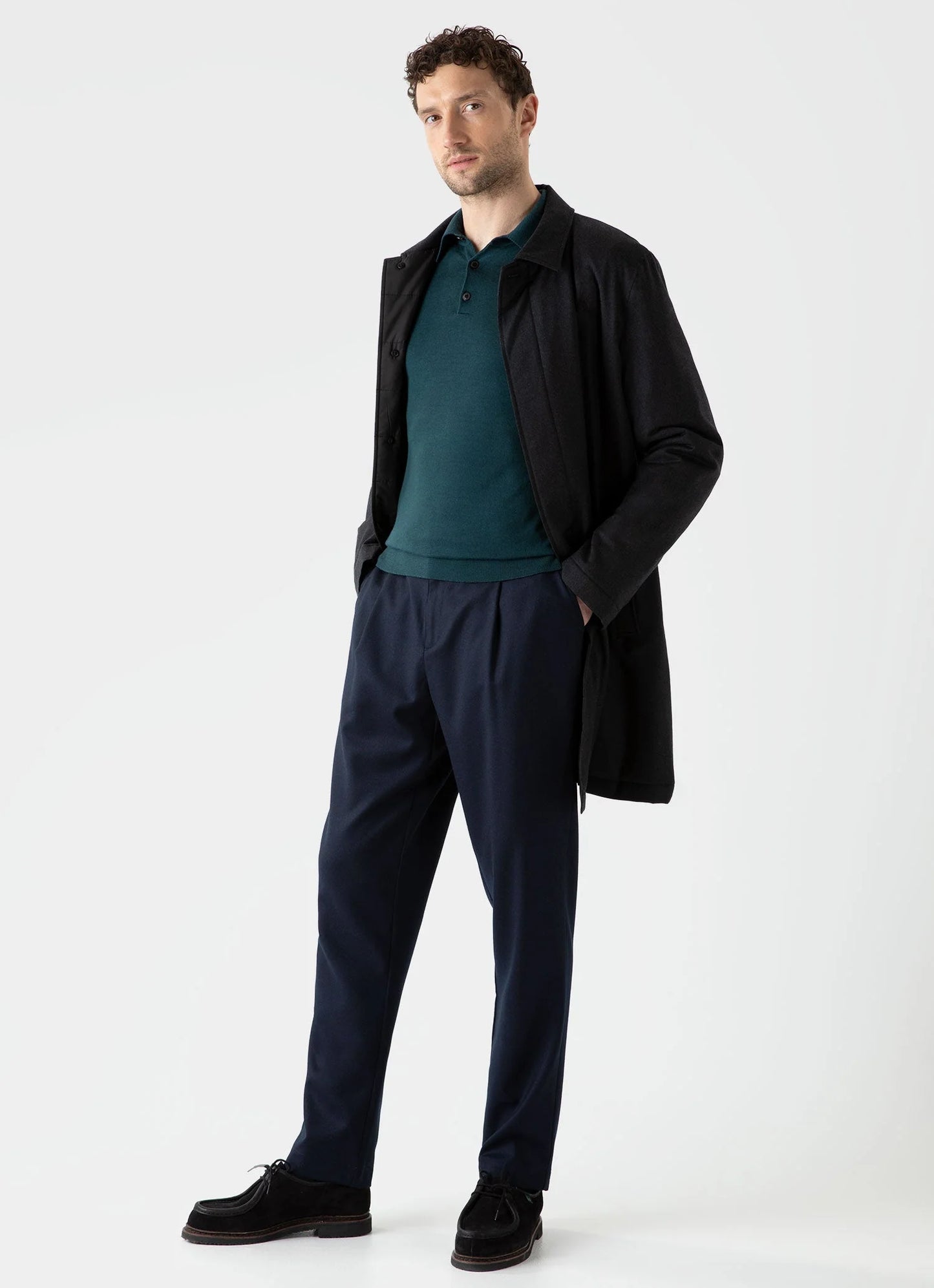 Model wearing Sunspel - Fine Merino Wool LS Polo Shirt in Peacock.