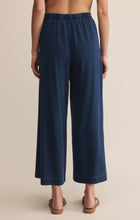 Load image into Gallery viewer, Model wearing ZSupply - Scout Jersey Pant in Indigo -back.

