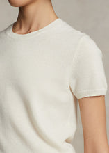 Load image into Gallery viewer, Model wearing Polo Ralph Lauren - Cashmere Short Sleeve Crewneck in Cream.
