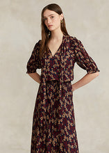 Load image into Gallery viewer, Model working Polo Ralph Lauren - Floral Tie-Neck Georgette Dress in Fall Poppy Floral.

