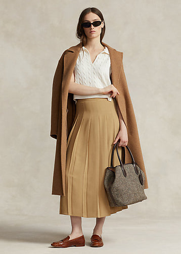 Model wearing Polo Ralph Lauren - Satin Pleated A-Line Midi Skirt in Camel.
