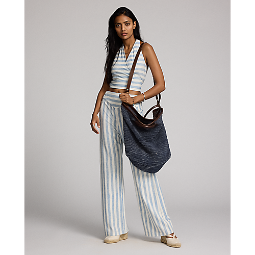 Model wearing RRL - Large Cotton/Jute/Leather Beach Bag in Indigo/Brown.