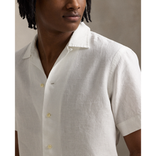 Load image into Gallery viewer, Model wearing  POLO Ralph Lauren - SS Garment Dyed Slubby Linen Andy Camp Shirt in Ceramic White.
