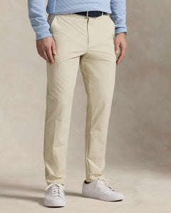 Model wearing  RLX - Ralph Lauren Performance Pant in Sand.