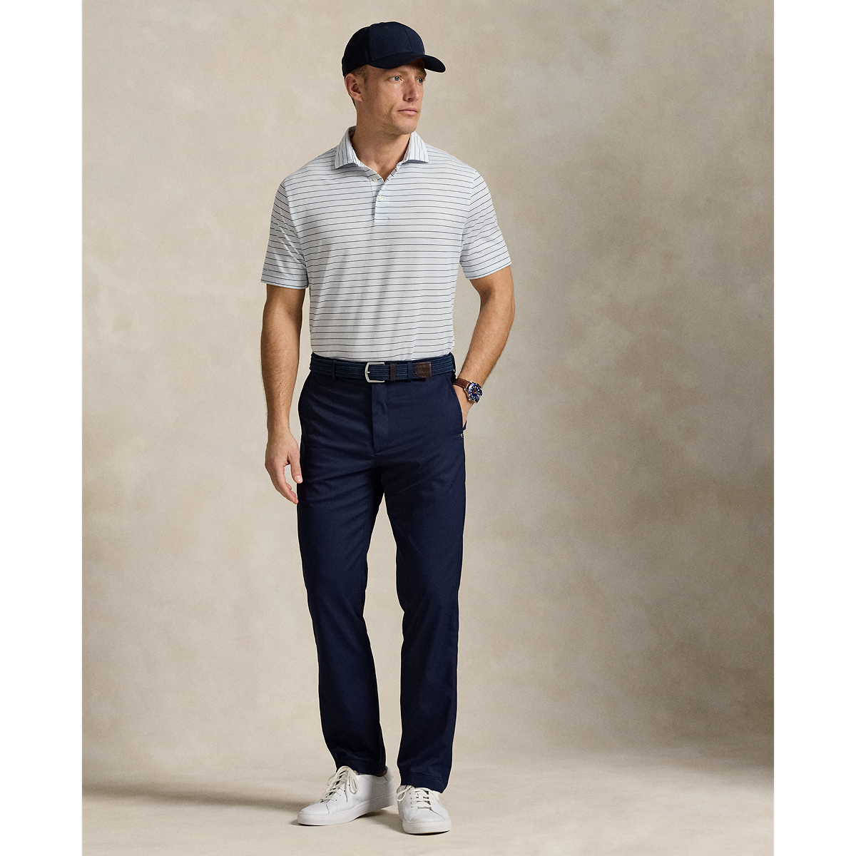 Model wearing RLX - Ralph Lauren Classic Fit Performance Polo Shirt in Office Blue Multi.