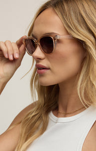 Model wearing ZSupply Shoreline Sunglasses in Sand - Gradient Polarized.