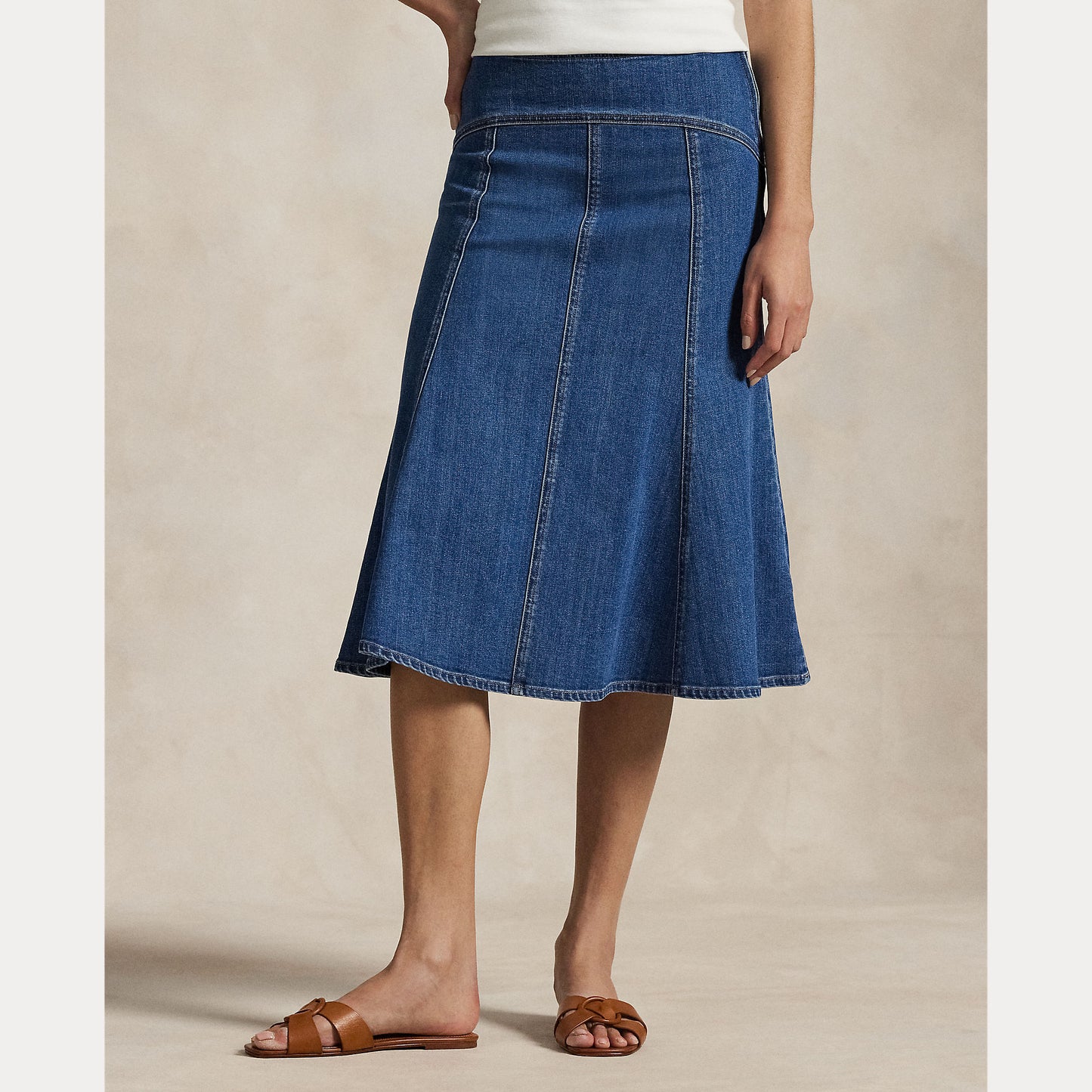 Model wearing Polo Ralph Lauren - Paneled Denim A-Line Skirt in Bostwich Wash.