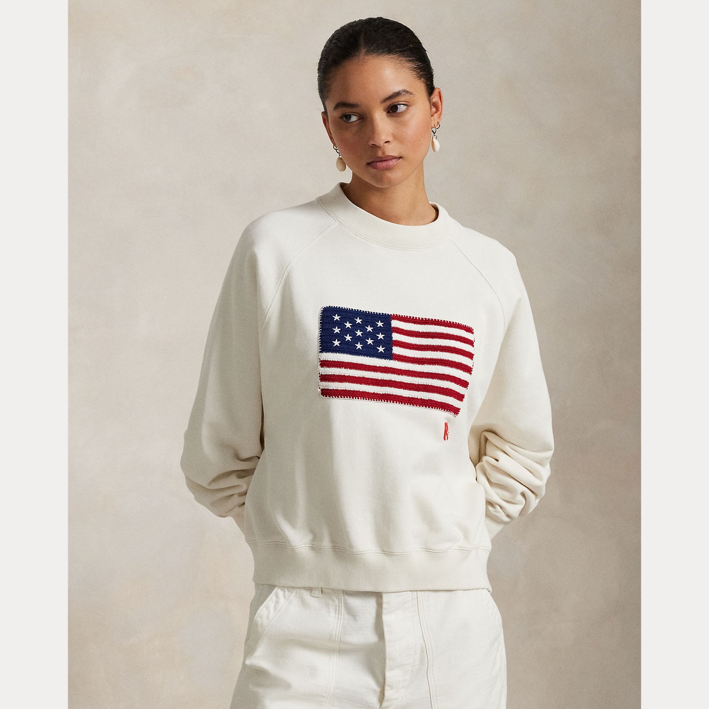 Model wearing Polo Ralph Lauren - Logo Flag French Terry Crewneck Sweatshirt in Nevis.