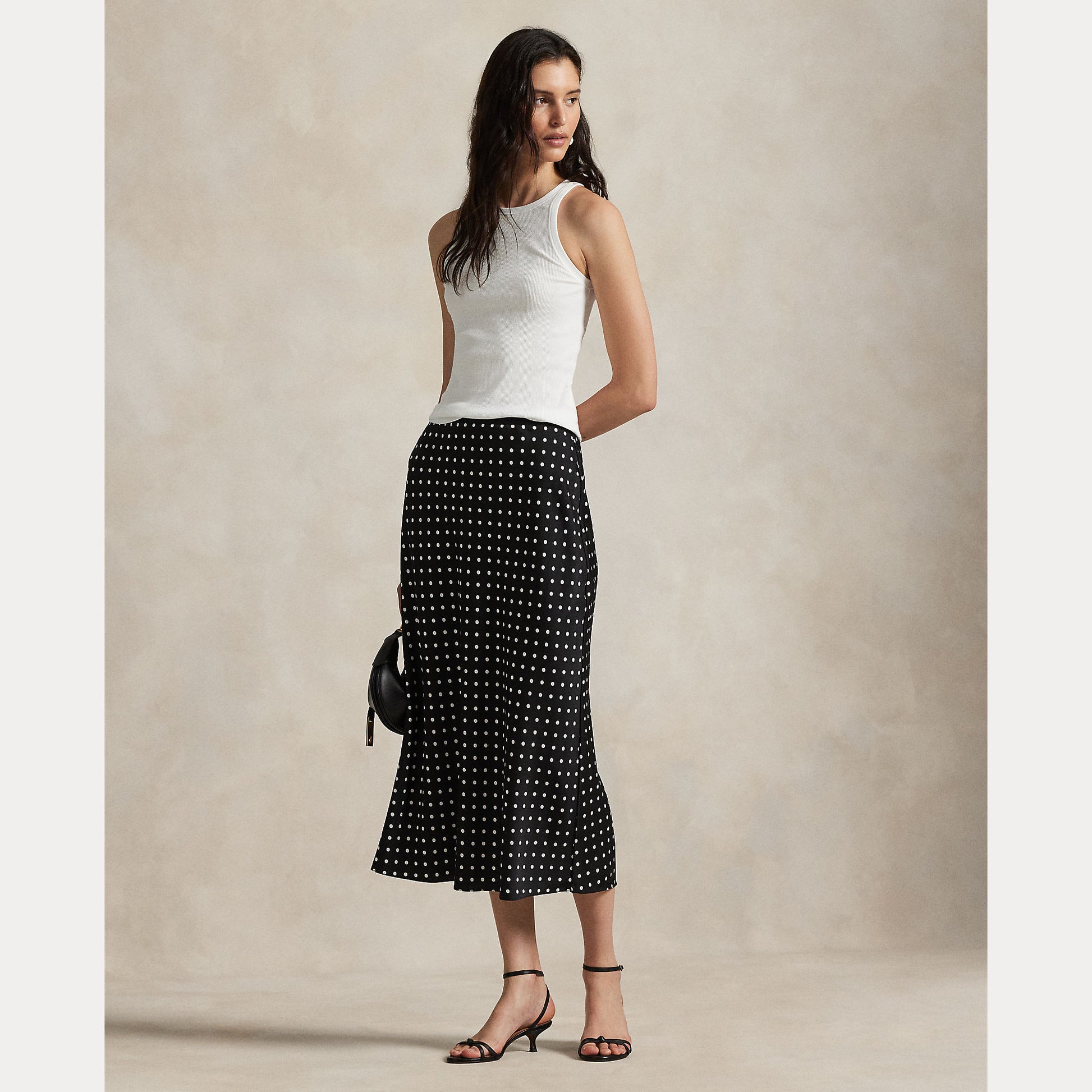 Model wearing Polo Ralph Lauren - Poly Satin Polka Dot Maxi Pencil Skirt in Polka Dot Black/White.