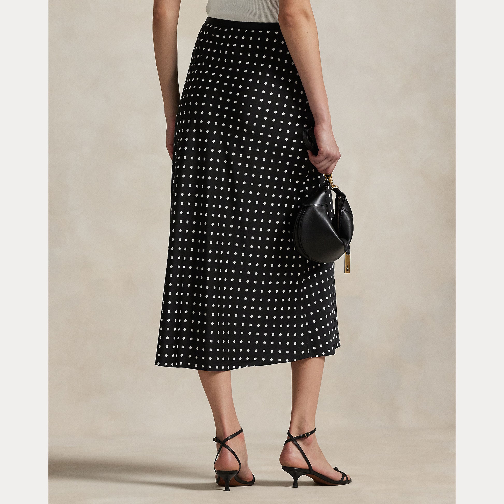 Model wearing Polo Ralph Lauren - Poly Satin Polka Dot Maxi Pencil Skirt in Polka Dot Black/White - back.