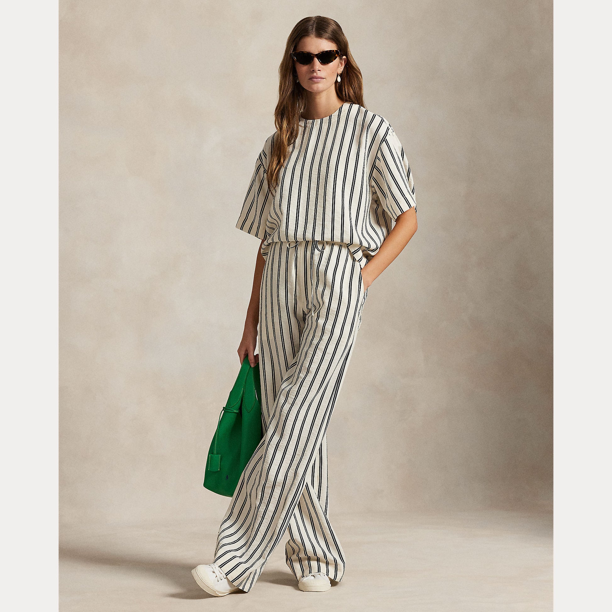 Model wearing Polo Ralph Lauren - Silk Nylon SS Crew Neck Blouse in White/Black Stripe.