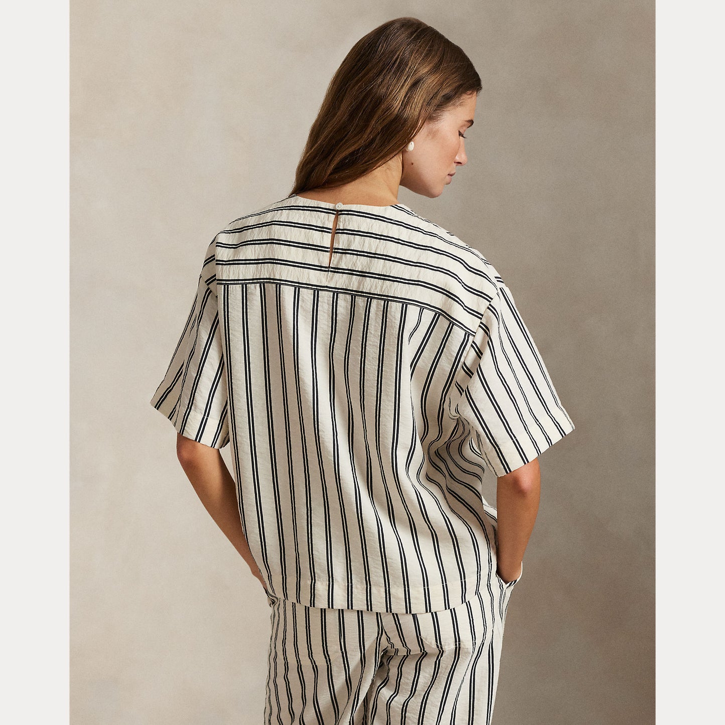 Model wearing Polo Ralph Lauren - Silk Nylon SS Crew Neck Blouse in White/Black Stripe - back.