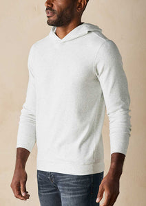 Model wearing The Normal Brand - Puremeso Essential Hoodie in Stone.