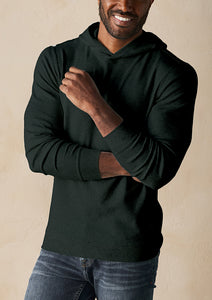 Model wearing The Normal Brand - Puremeso Essential Hoodie in Emerald