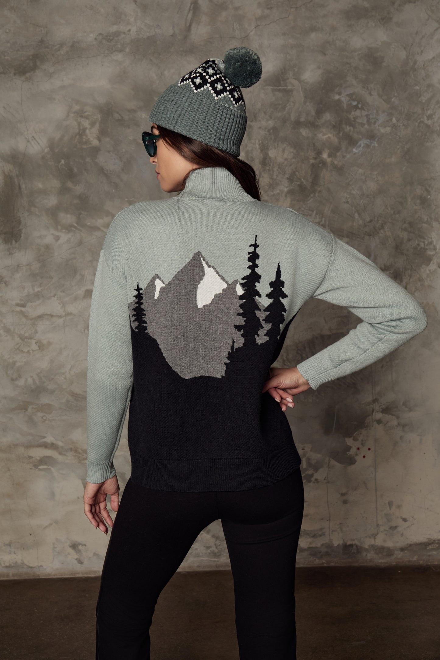 Model wearing Alp N Rock - Simran Mockneck Sweater in Silver Blue - back.