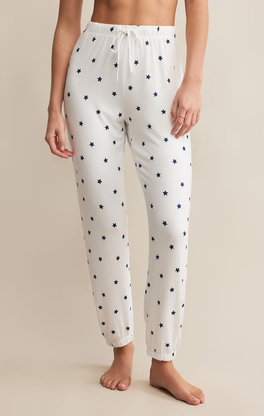 Model wearing ZSupply - Classic Mini Stars Jogger in White/Navy.