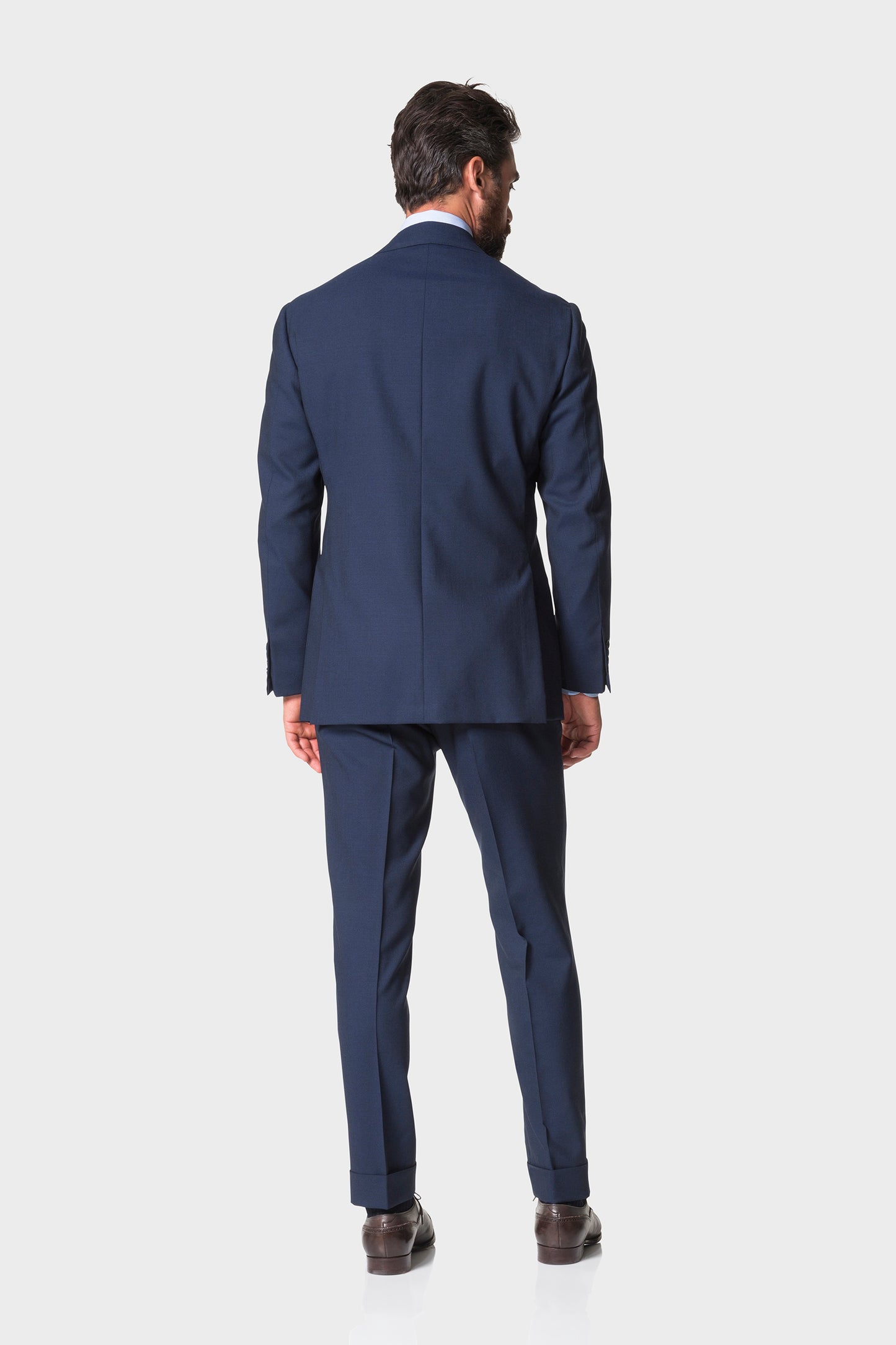 Model wearing Ring Jacket Calm Twist suit - navy - back.