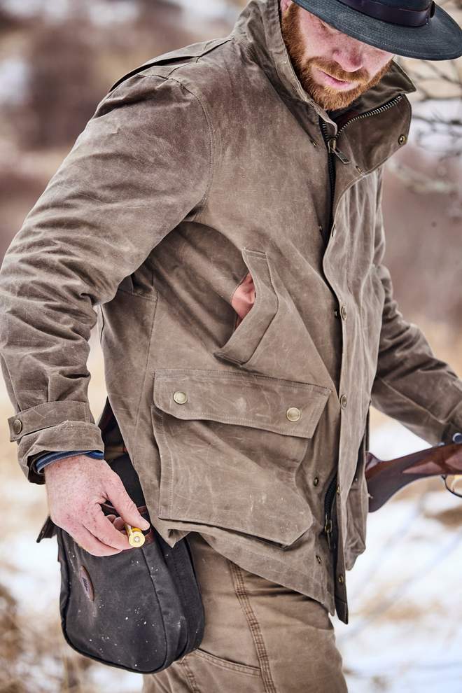 Model wearing Tom Beckbe Tensaw jacket in tobacco.