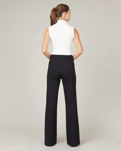 Model wearing Spanx - The Perfect Pant, Hi-Rise Flare in Classic Black 20252R - back.