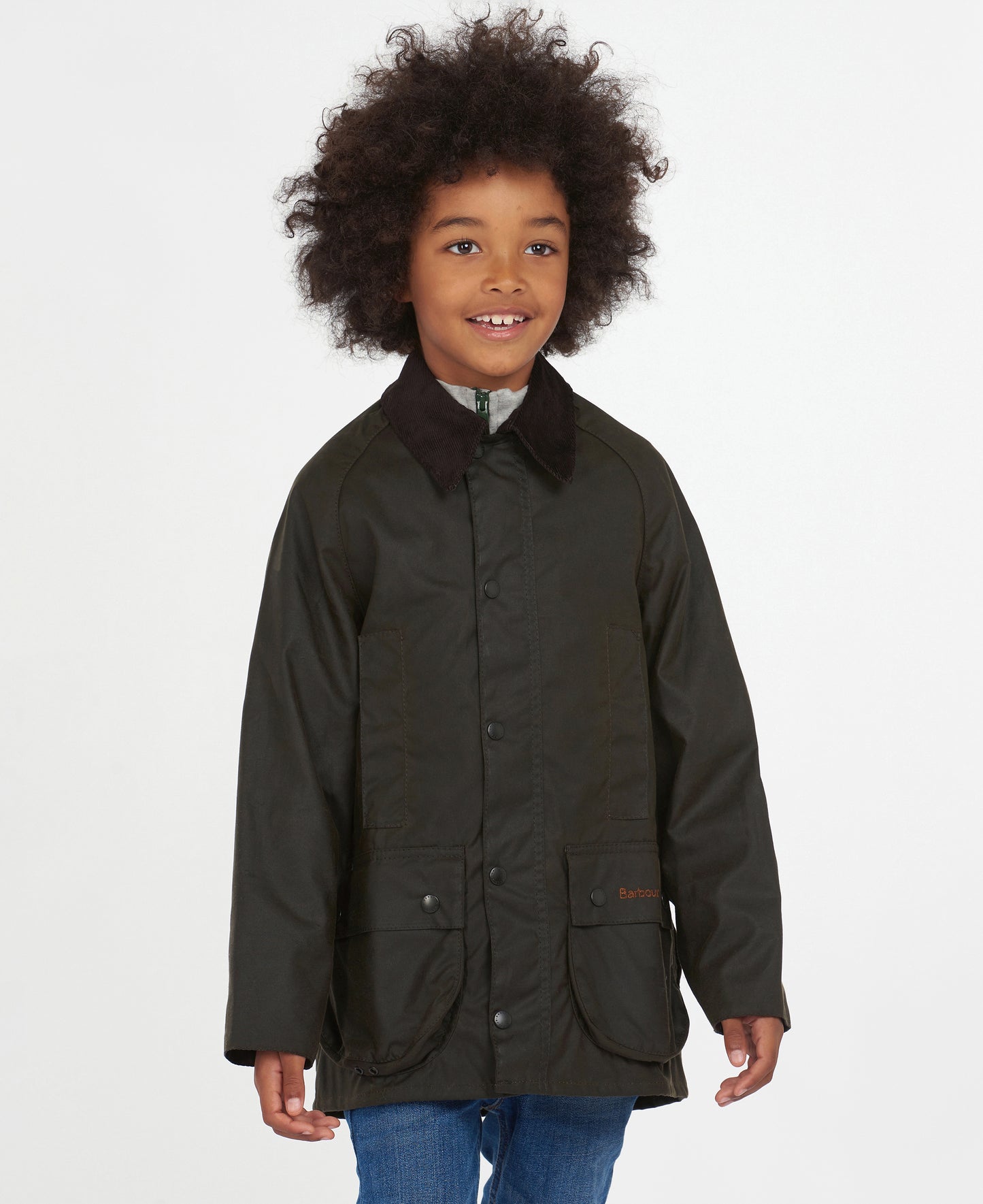 Model wearing Barbour Youth Beaufort Jacket in Olive.