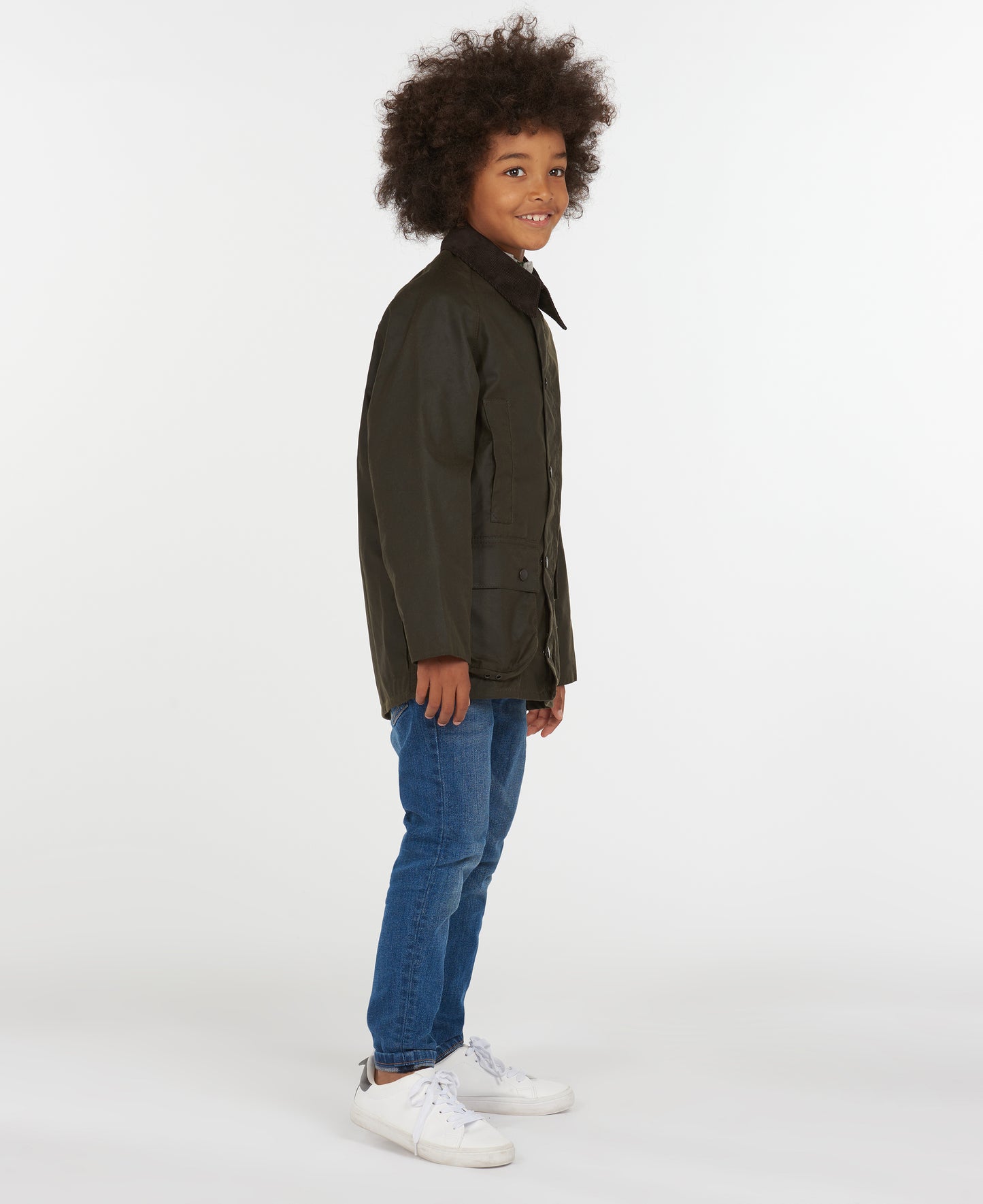 Model wearing Barbour Youth Beaufort Jacket in Olive.