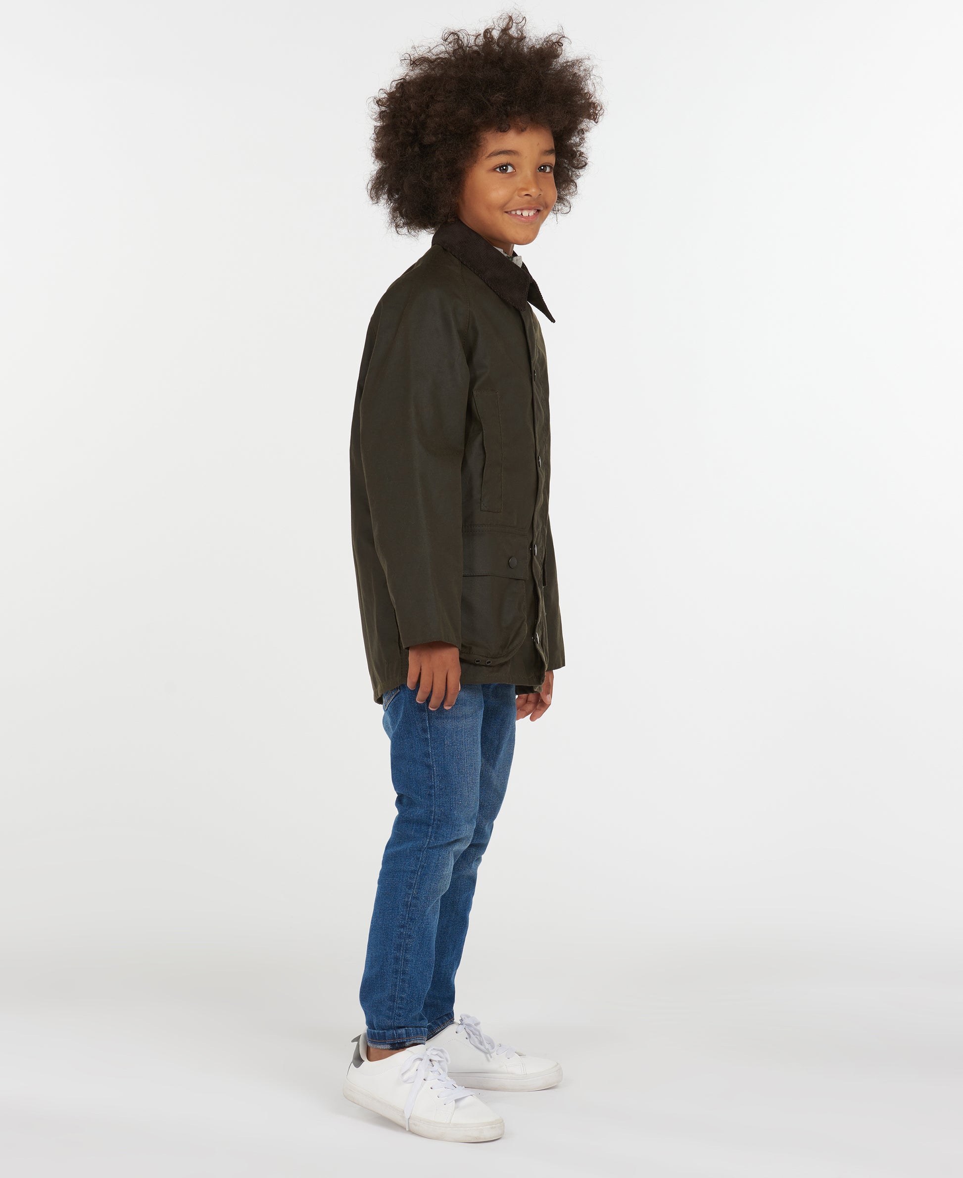 Model wearing Barbour Youth Beaufort Jacket in Olive.