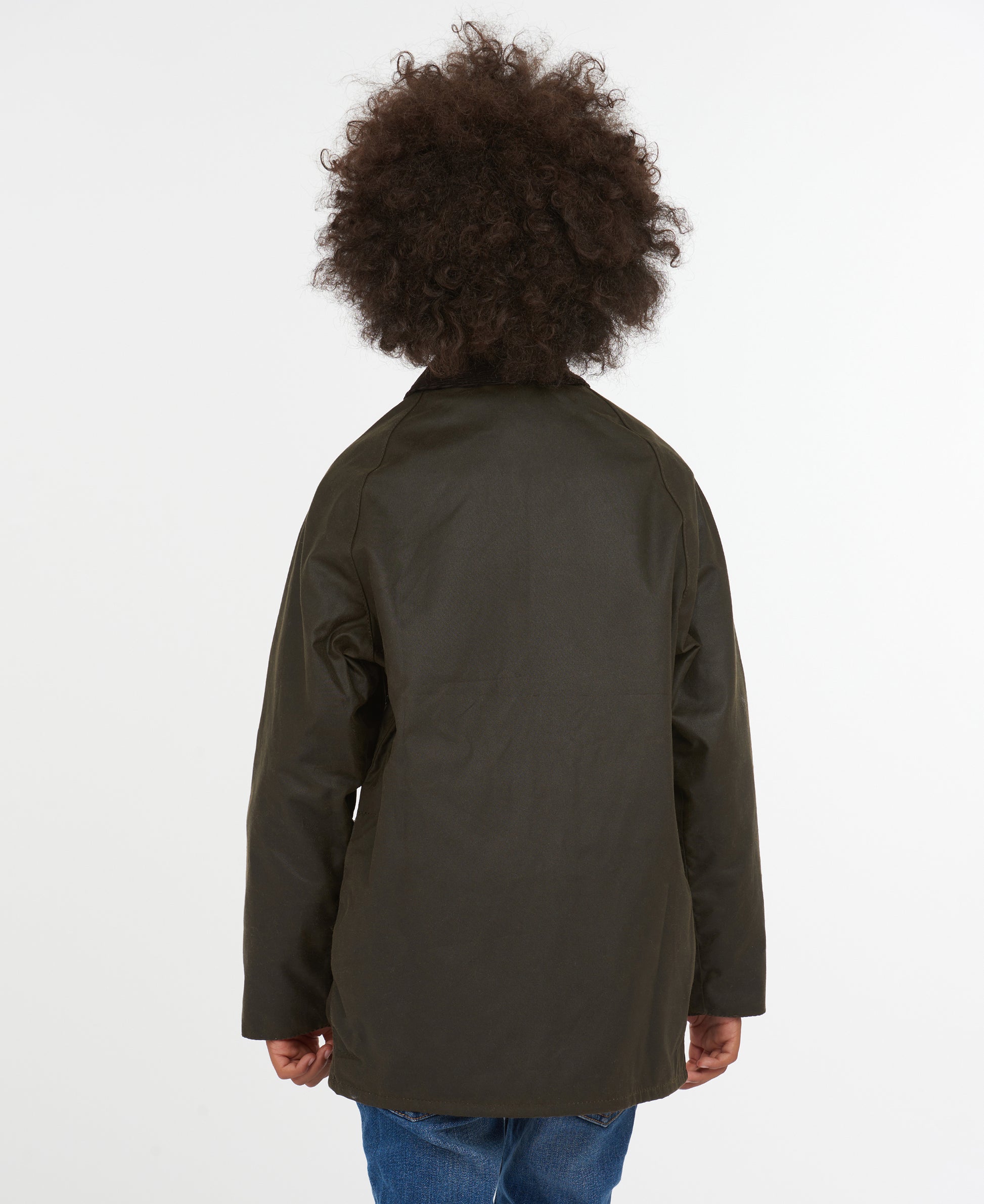 Model wearing Barbour Youth Beaufort Jacket in Olive.