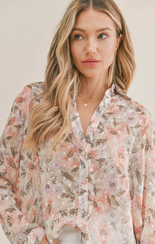 Model wearing Sadie & Sage - Dune Flowers Button Down Top in Ivory Apricot.