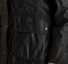 Load image into Gallery viewer, Model wearing Barbour Beadnell wax jacket in black.

