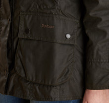Load image into Gallery viewer, Model wearing Barbour Beadnell wax jacket in olive.
