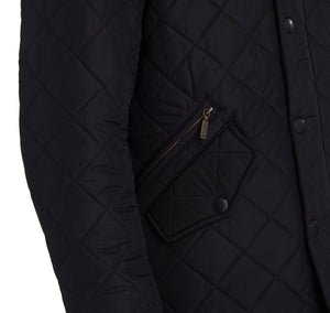 Pocket of Barbour Powell Quilt jacket in black.