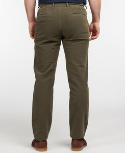 Model wearing Barbour Neuston Moleskin Pants in Dark Olive - back.