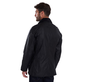 Back view of a model wearing a Barbour Ashby waxed jacket in black.