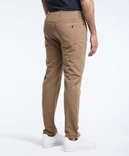 Load image into Gallery viewer, Model wearing Public Rec Workday Pant straight leg in dark khaki.
