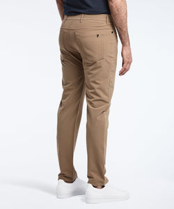 Model wearing Public Rec Workday Pant straight leg in dark khaki.