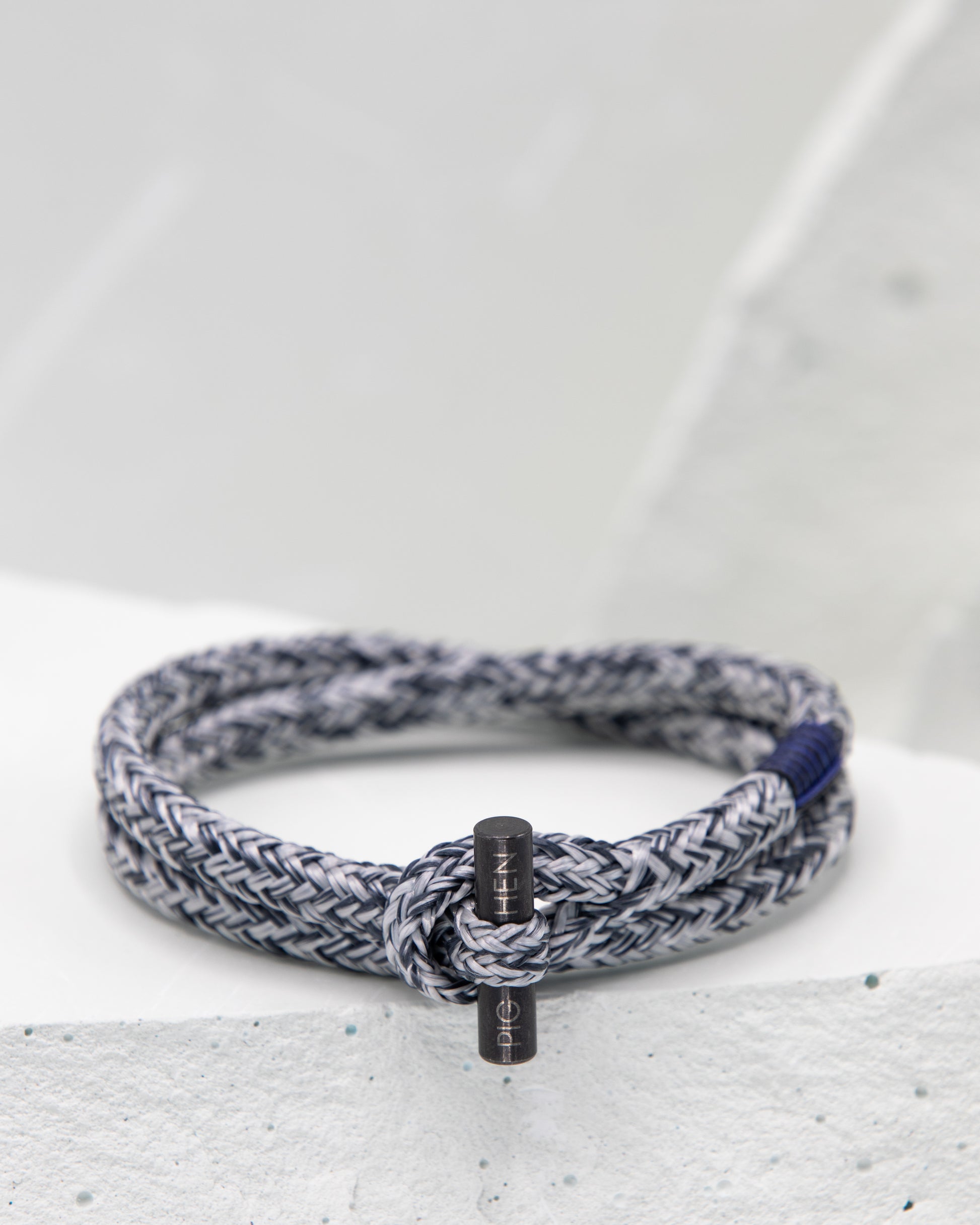 Pig & Hen Tiny Ted slate gray and light grace with black buckle bracelet.