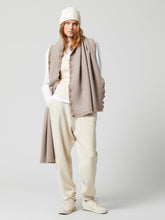 Load image into Gallery viewer, Model wearing Begg &amp; Co - Washed River Eco Twill Merino Cashmere Scarf in Dark Natural.
