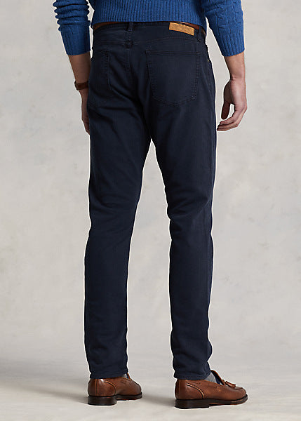 Model wearing POLO Ralph Lauren - Sullivan Slim Knitlike Chino Pant in Avaitor Navy - back.