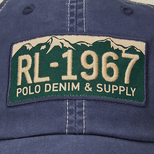Load image into Gallery viewer, Polo Ralph Lauren - Stretch Twill Classic Sport Trucker Hat with License Plate Emblem in Newport Navy.
